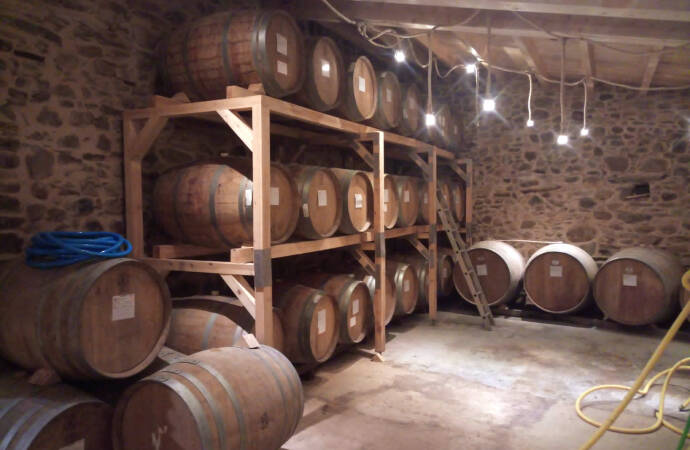 Image of barrels inside the LOF Wines winery.